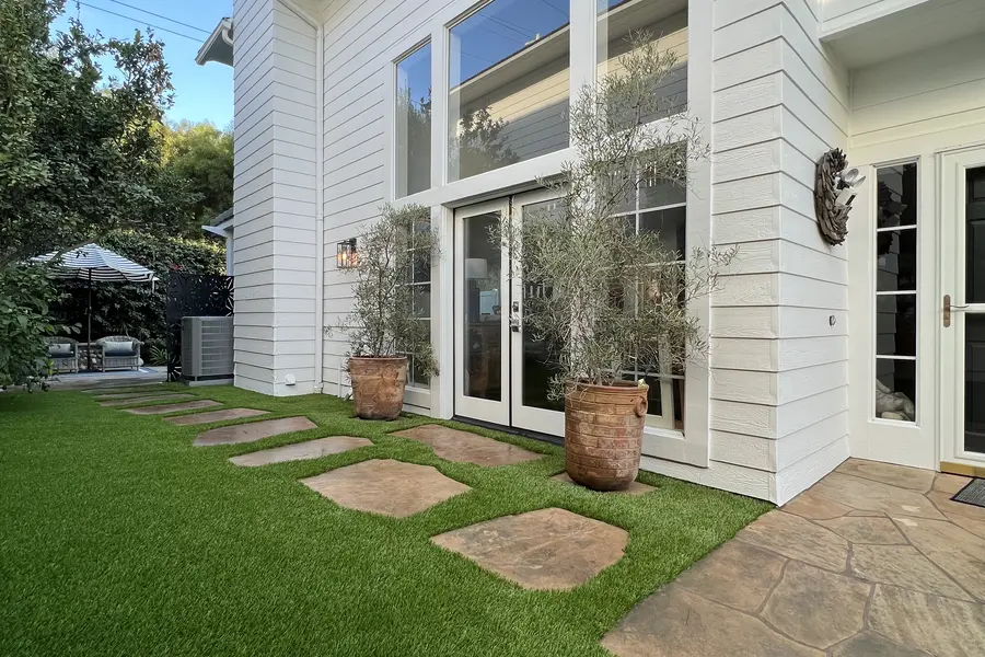 Stepping stones set into a turf front walk