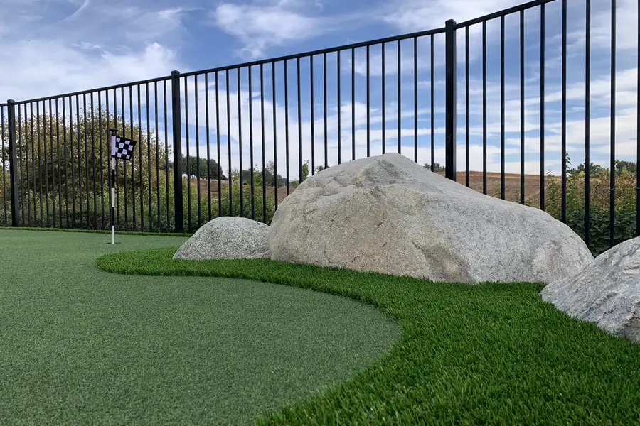 Green with boulder feature · black-rail fence line