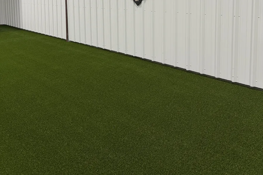 Indoor training turf meeting the facility wall line