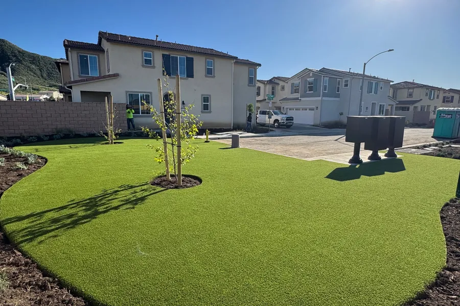 HOA community front yard with fresh artificial turf in Menifee