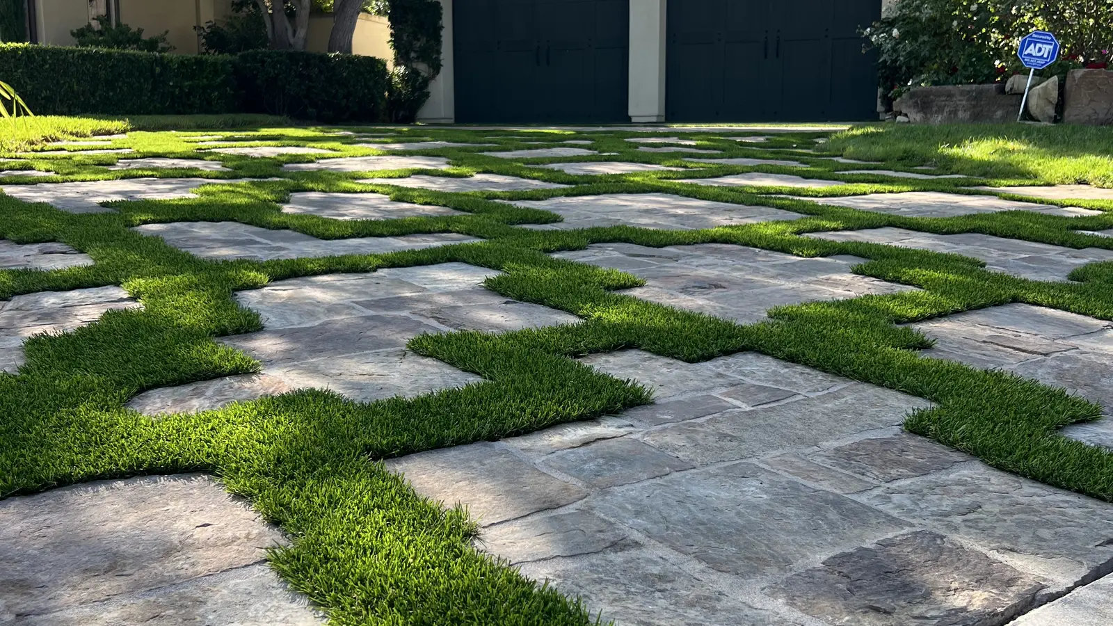 Paver and turf checkerboard driveway installation