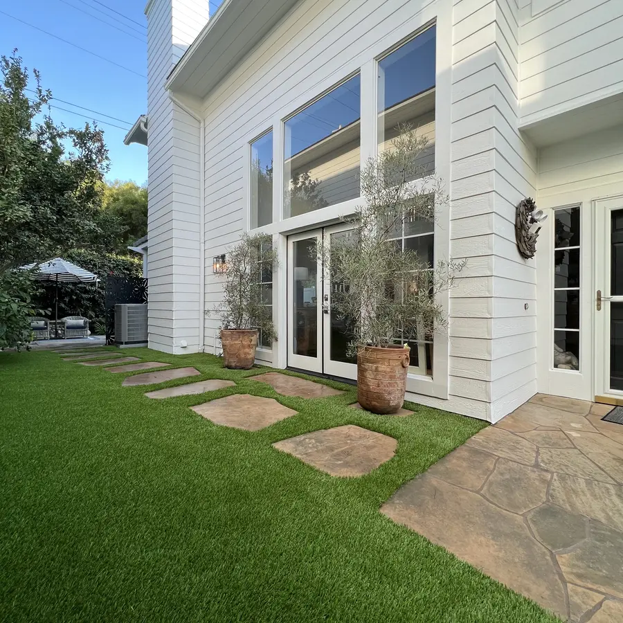 Stepping-stone front walk set into artificial grass